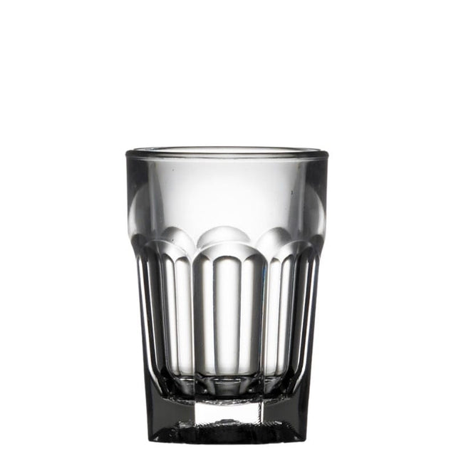 Clear plastic shot glass with vertical ridges on a white background